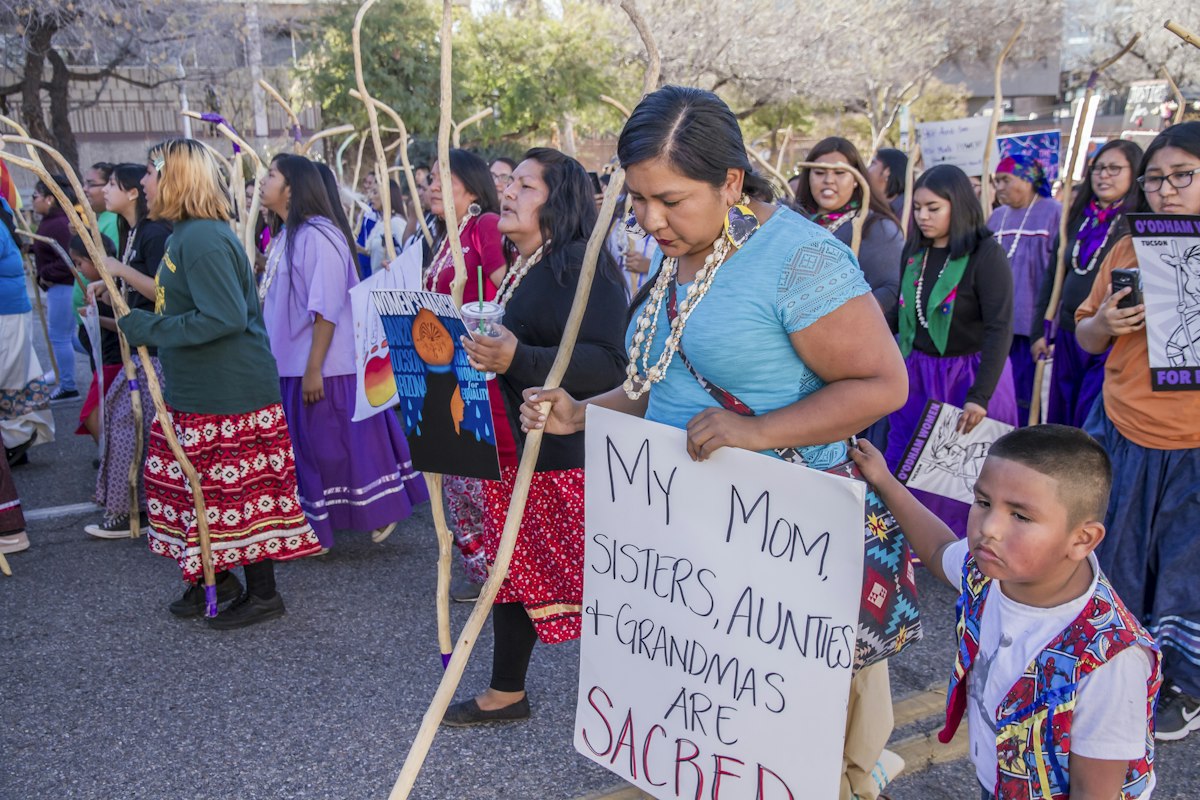 Mothers and families marching together in their community